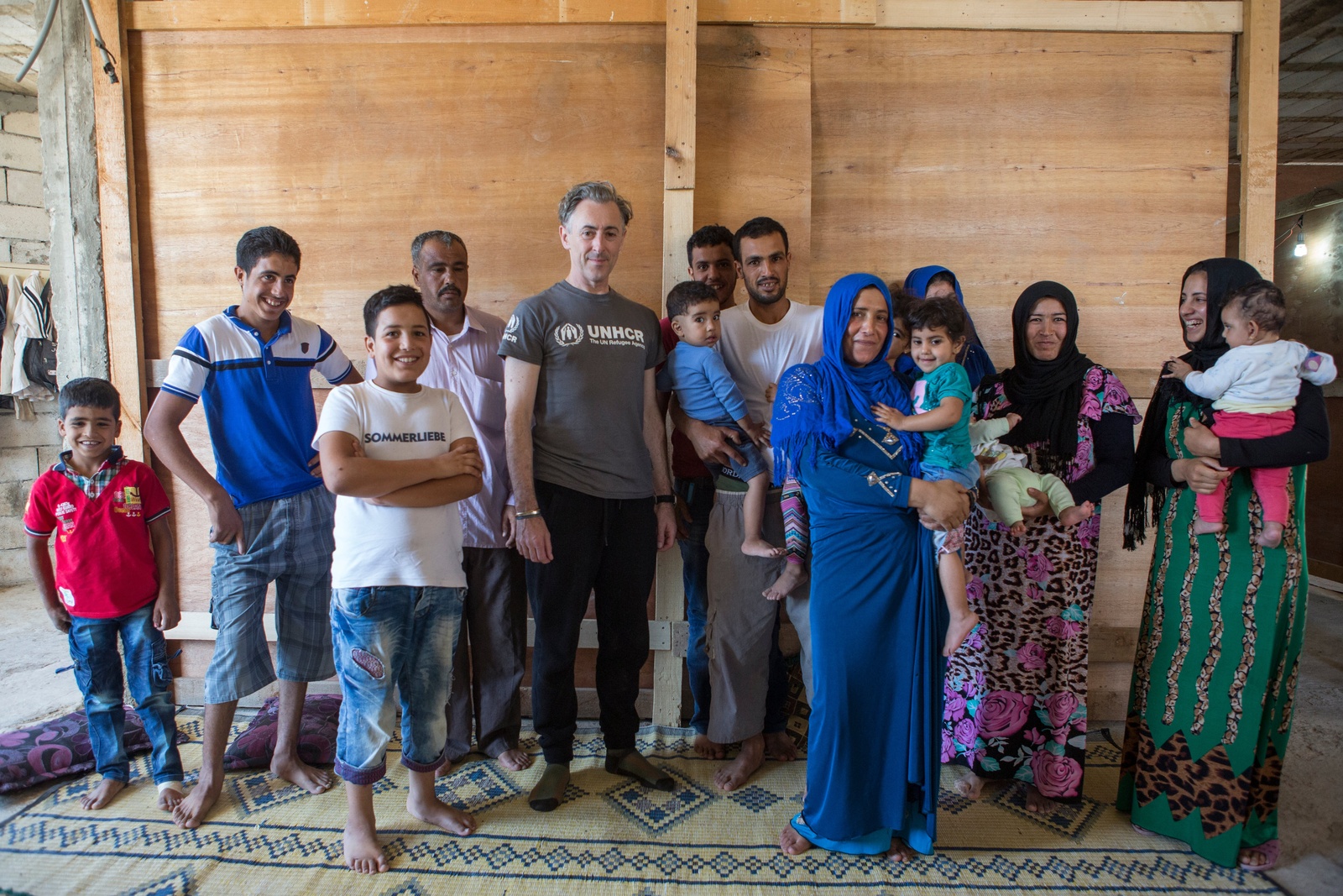 Lebanon. UNHCR High Profile Supporter Alan Cumming meets three Syrian refugee families living together in substandard shelter in Beissarieh in southern Lebanon