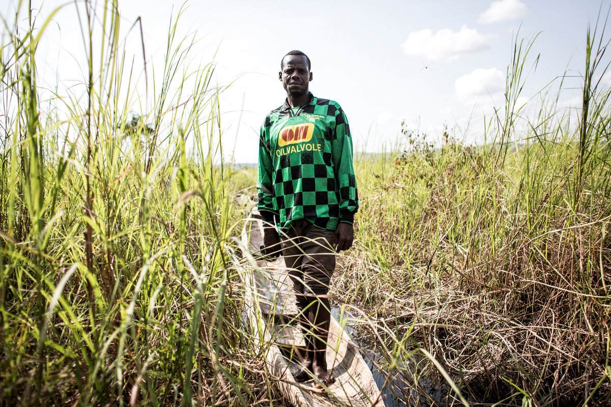 Democratic Republic of Congo. A Central African Refugee stands in his pirogue in the village of Nzakara on the banks of the Ubangi River.