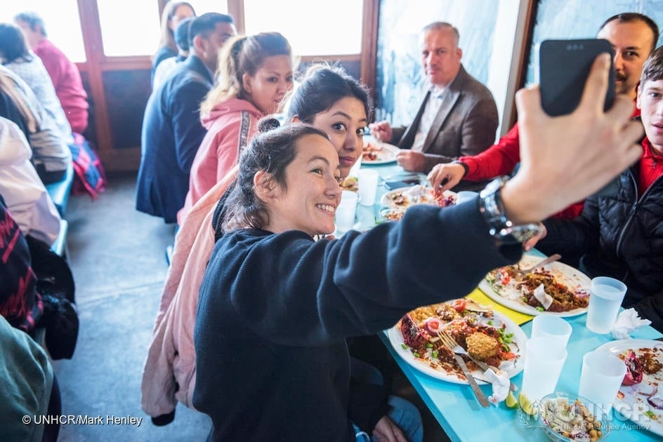 The popular restaurant at the lakefront Bains des Pâquis provides lunch for a group of refugees – attended by UN High Commissioner for Refugees Filippo Grandi – during the Global Refugee Forum in Geneva.