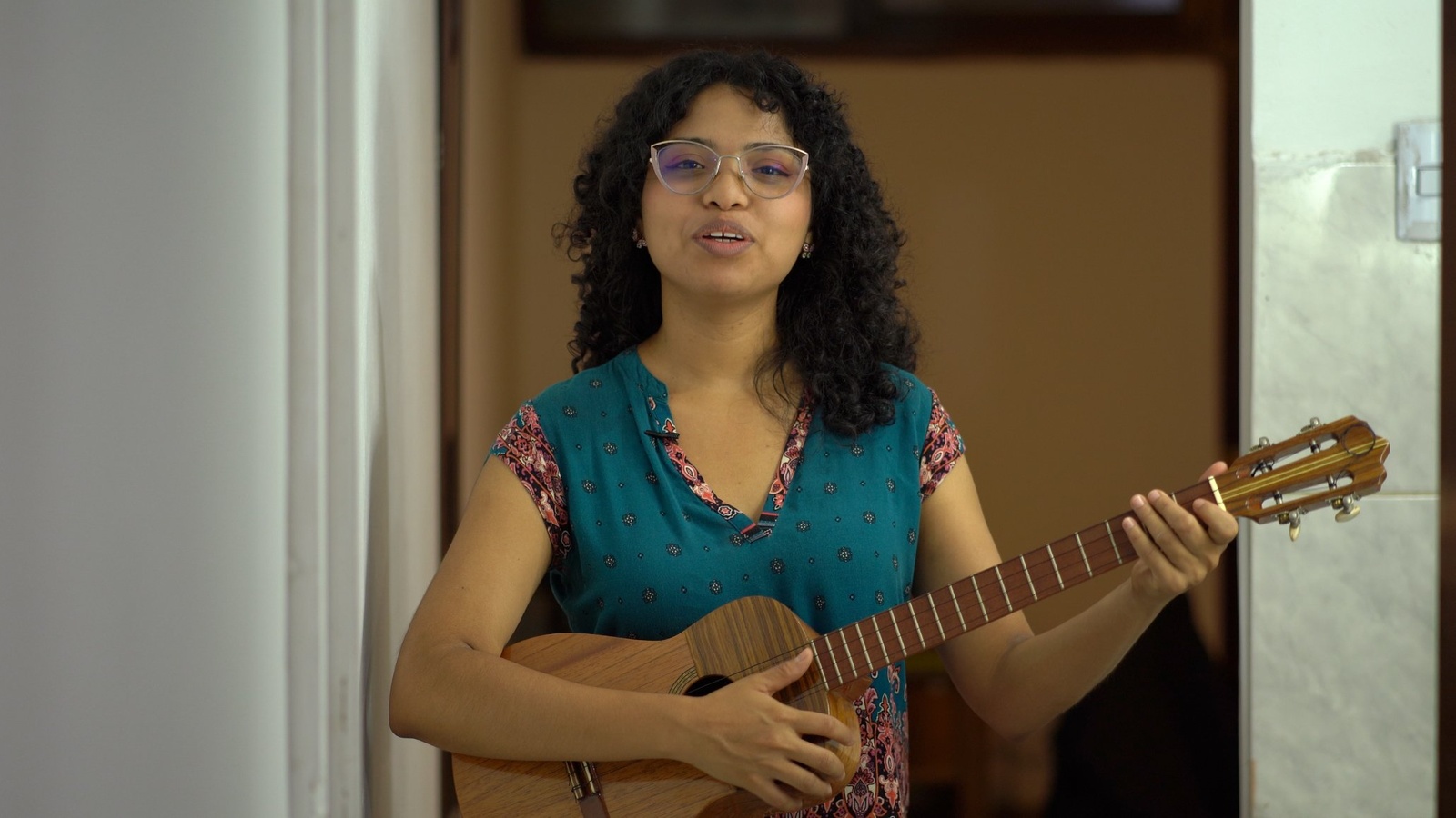 Cristina playing the cuatro