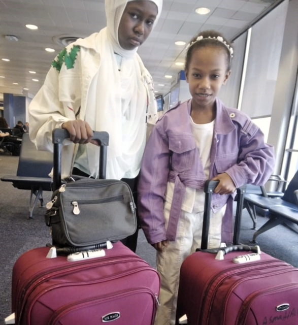 The daughters of Asma and Mohammad at the airport, ready to travel to the United States to start their new lives.