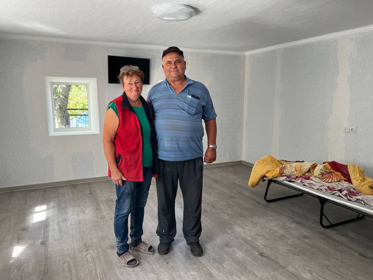 Vasyl and Nataliia Berest are in their home, dry and warm thanks to the repairs made possible through the generous funding support from ECHO and other donors. ©UNHCR/Denys Kovalskyi