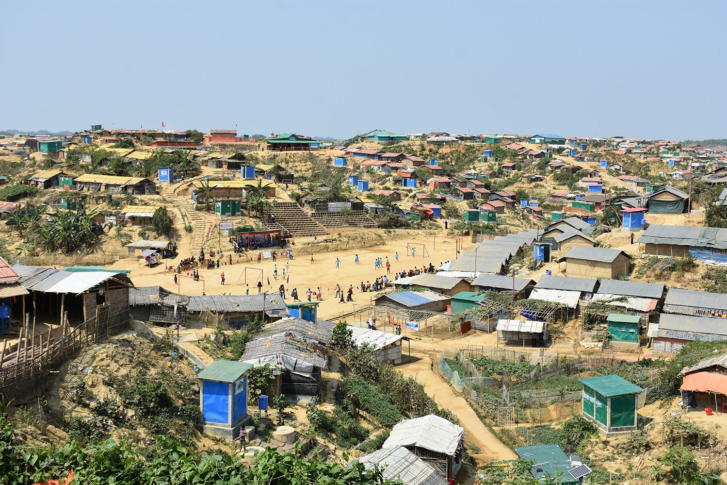 Rohingya refugees play football at a Cox's Bazar Refugee Camp