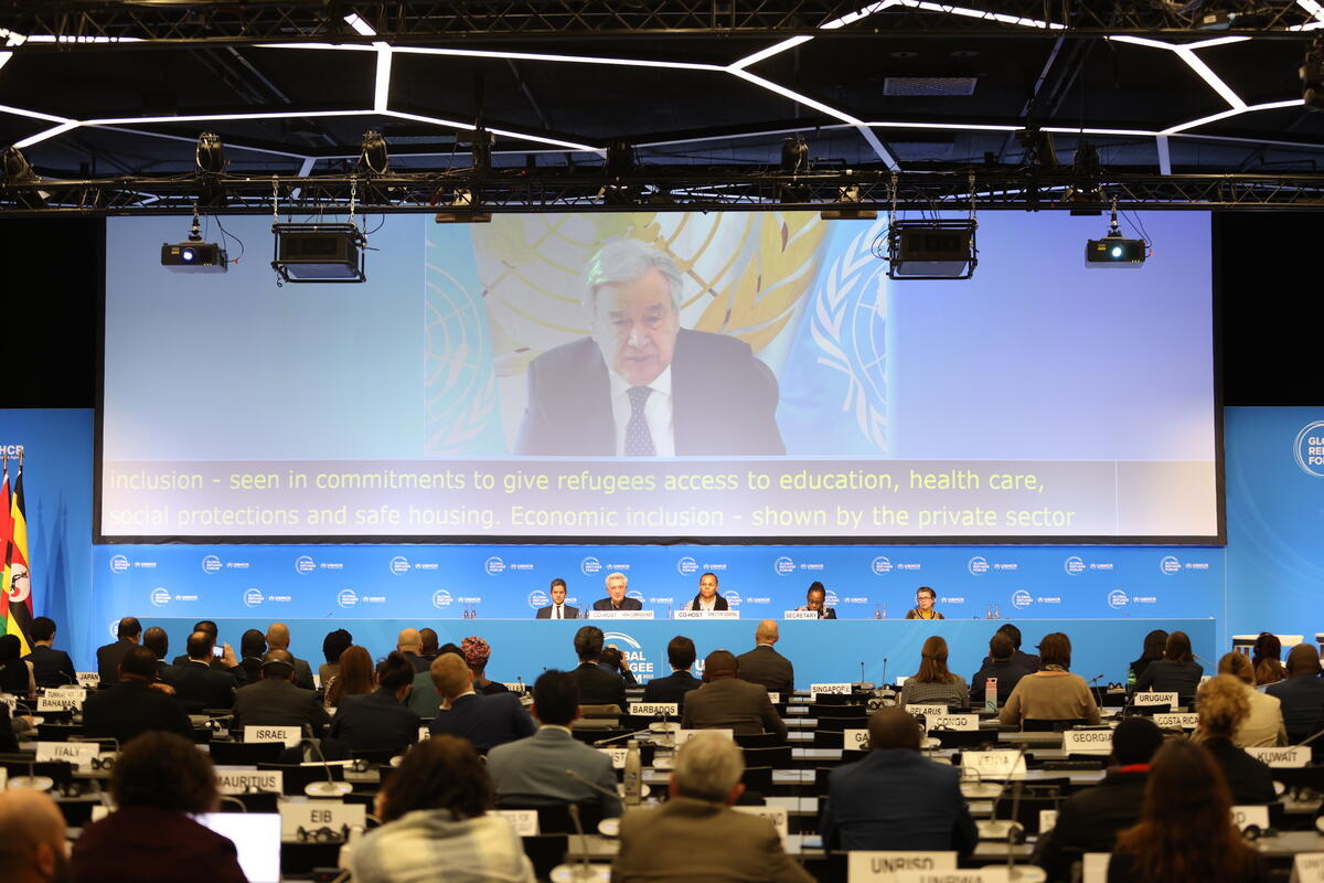 Antonio Guterres, United Nations Secretary-General, is seen onscreen at the final plenary and Closing Ceremony of the Global Refugee Forum 2023.