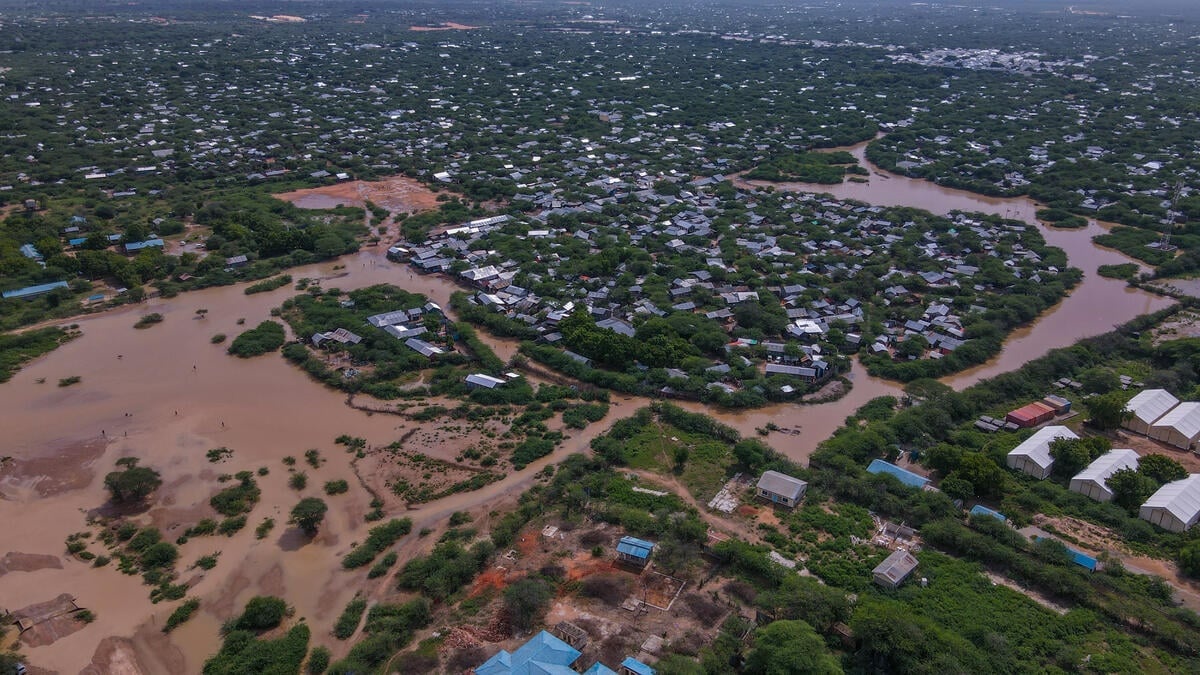 An aerial view of floodwaters surrounding shelters in a refugee settlement.