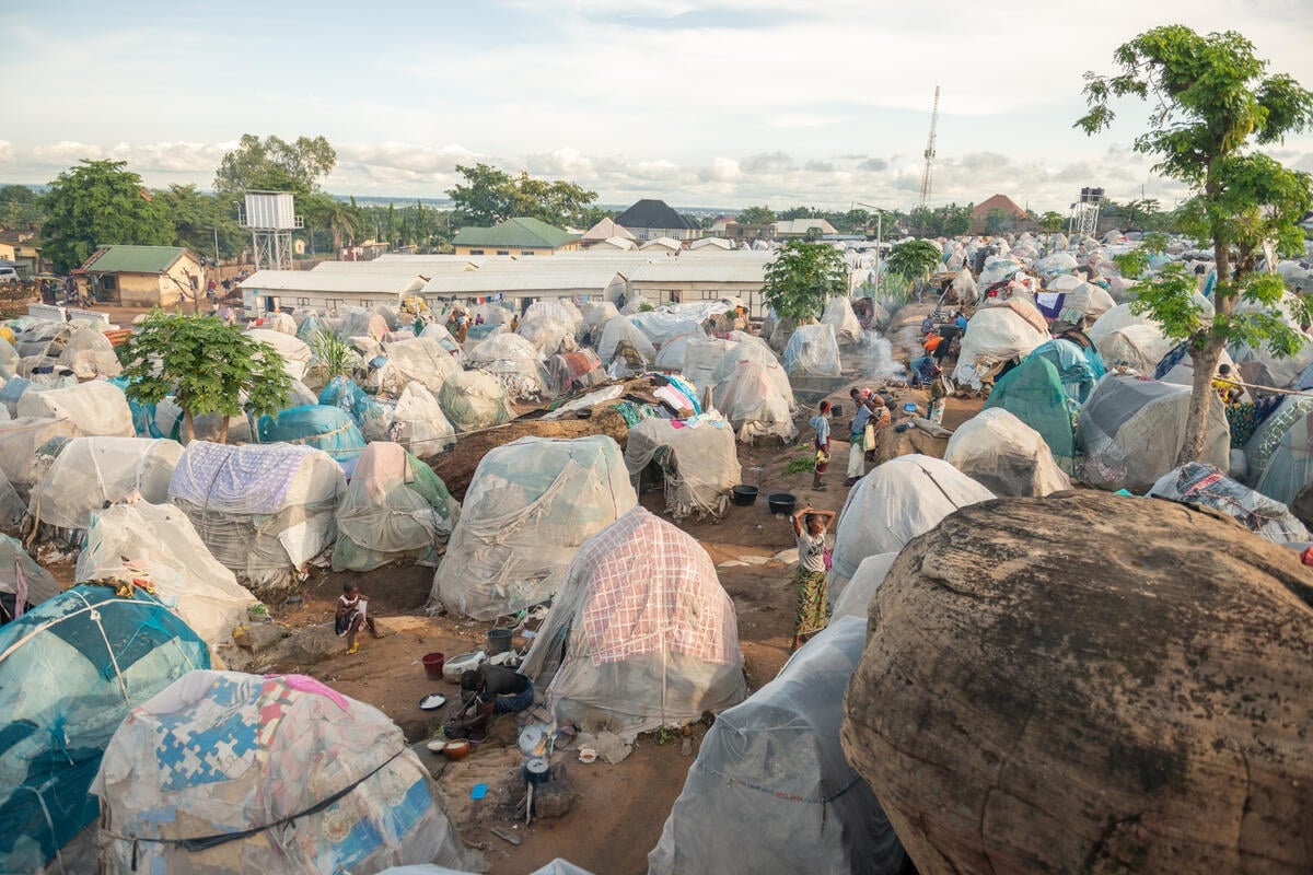 A view of small, makeshift shelters in a camp for displaced people.