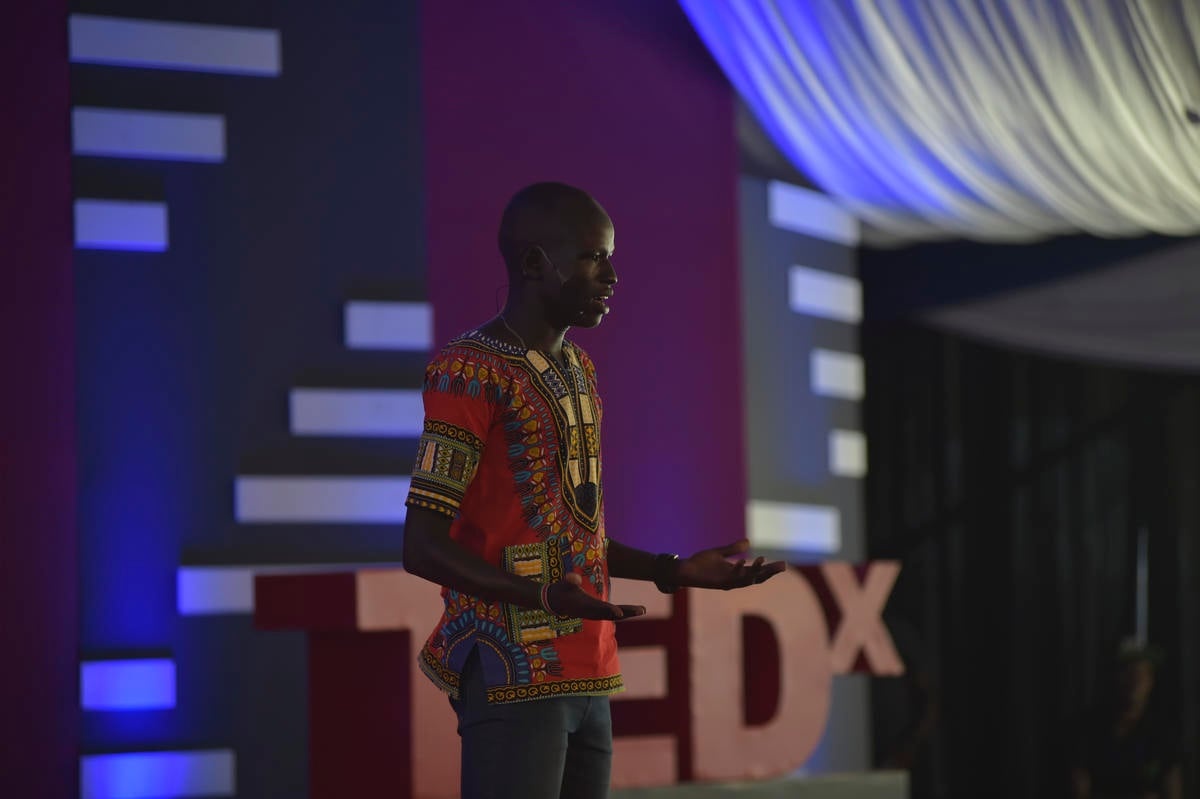 Yiech Pur Biel speaking on stage.