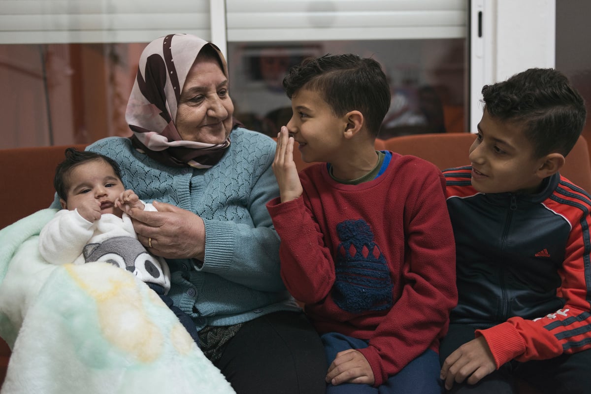 Grandmother Taqia and great grandchildren.