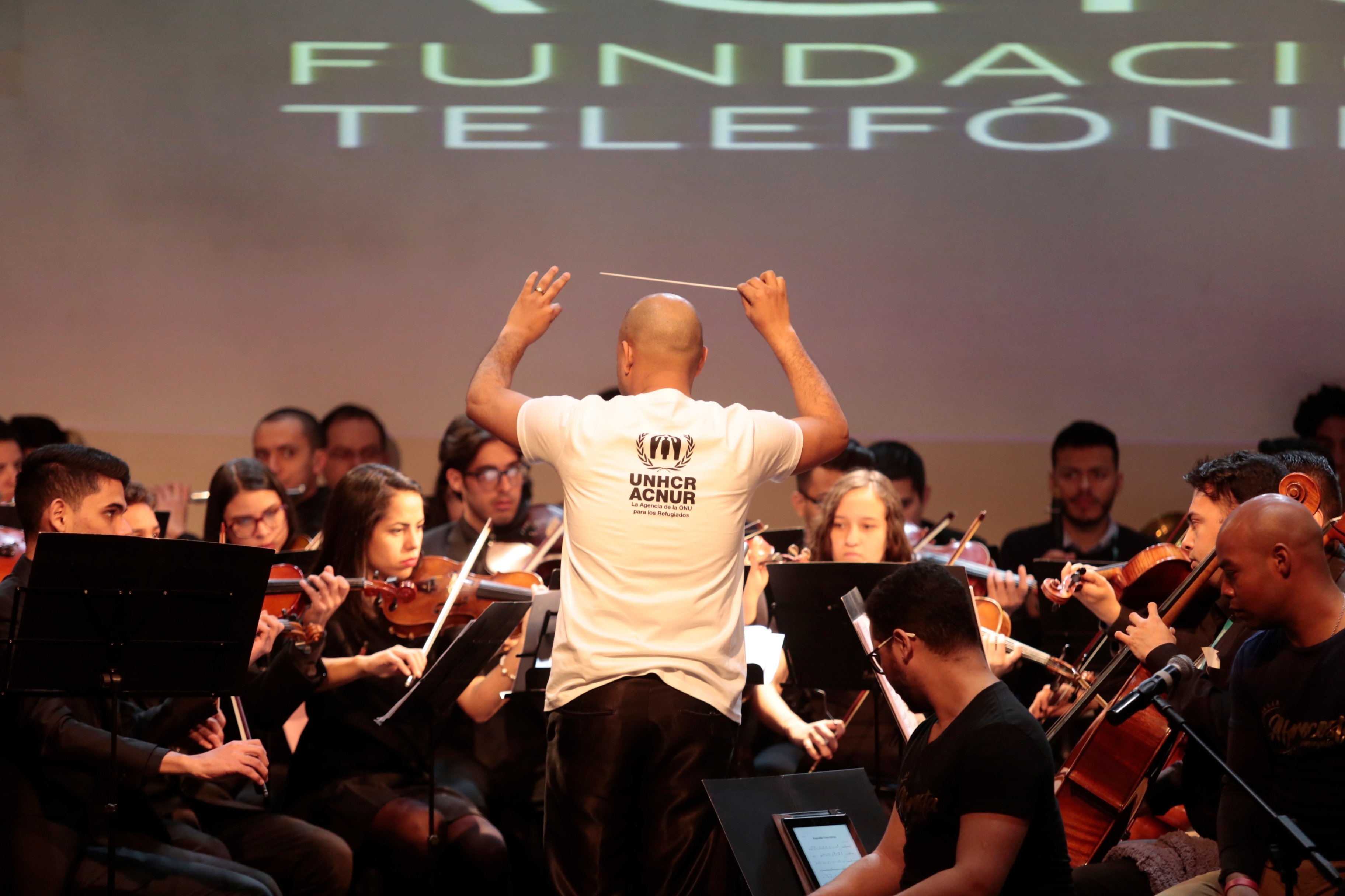 The Music for Integration Foundation Orchestra, led by Venezuelan conductor Simón Arias, performs in Santiago, Chile, in 2019.