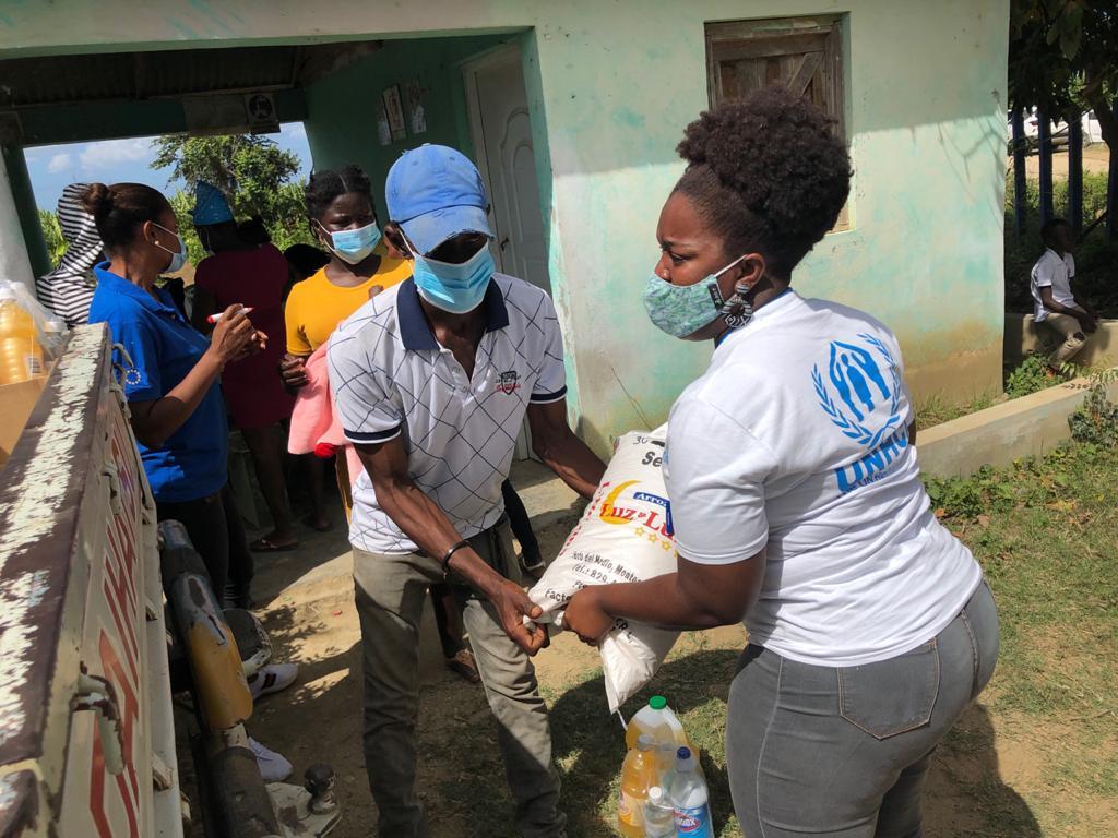 Pamela delivering food kits to families in need in the Dominican Republic.