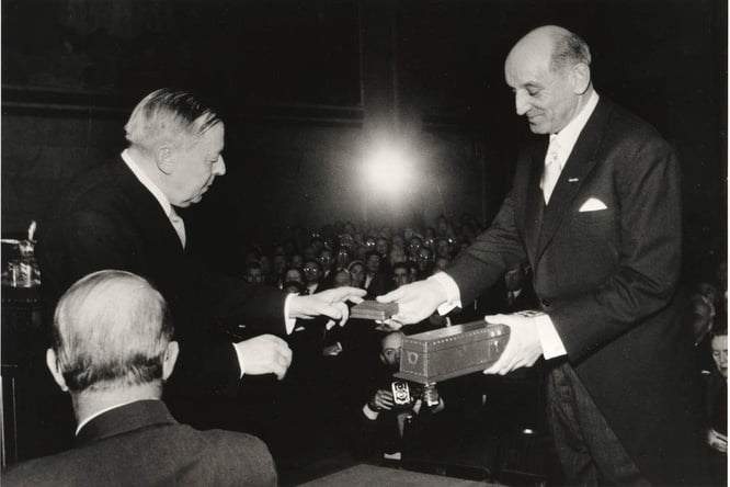 Mr. Gunnar Jahn, Chairman of the Norwegian Nobel Committee, hands the Nobel Peace prize to to the United Nations High Commissioner.