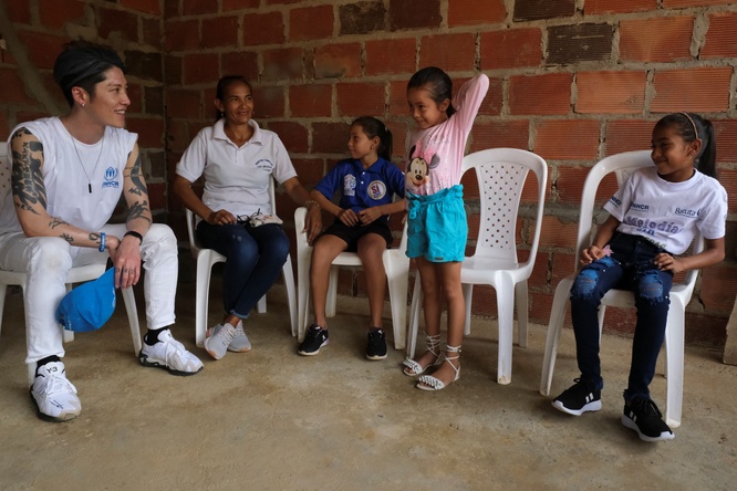 MIYAVI speaks to a small group of Venezuelan refugees and migrants 