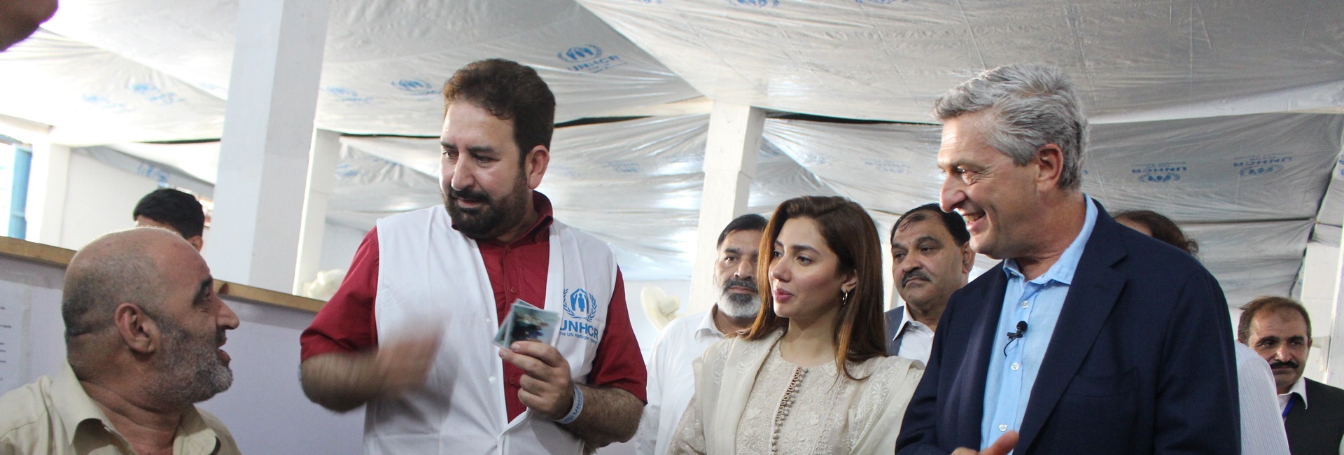 Pakistan. Goodwill Ambassador, Mahira Khan, observes as Afghan refugees go through resettlement process. 