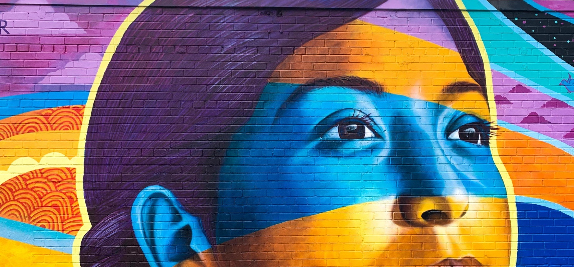 A mural representing the face of a young girl.