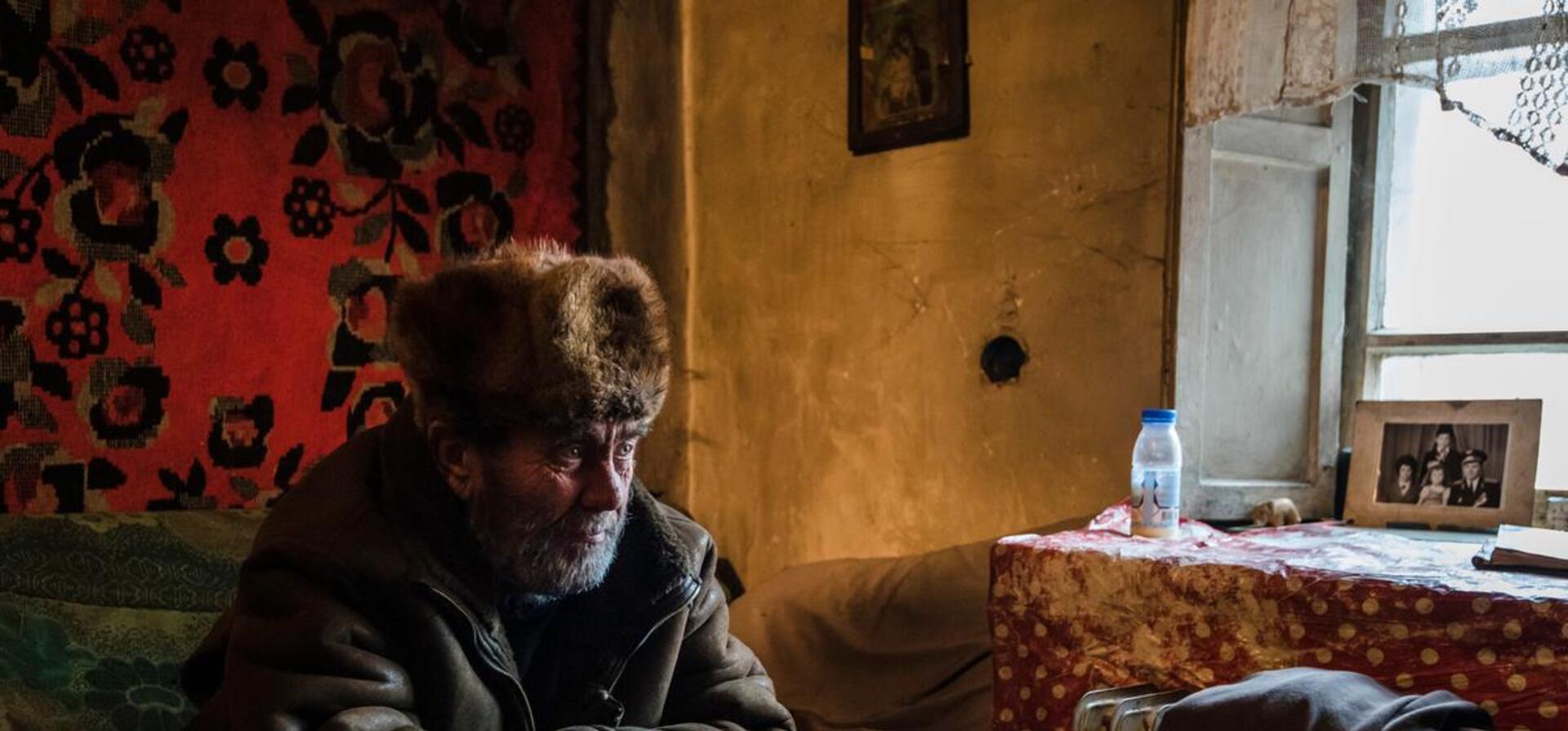 Ukraine. A man visits his neighbor near the front line