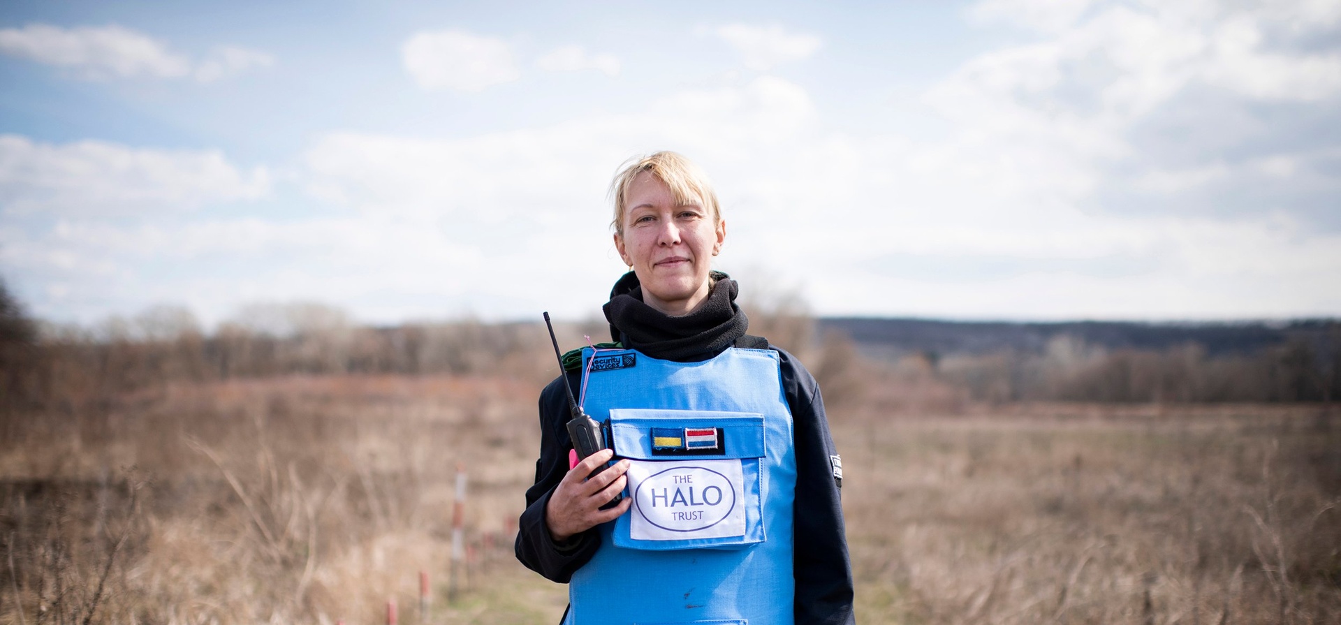 Ukraine. A female deminer in partially cleared minefield in the Donbas area