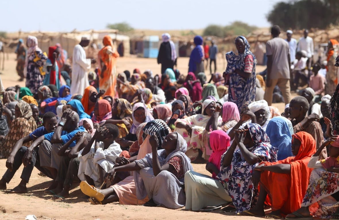 People who recently fled fighting in El Fasher and surrounding areas wait for assistance in Tawila, in Sudan's North Darfur State.