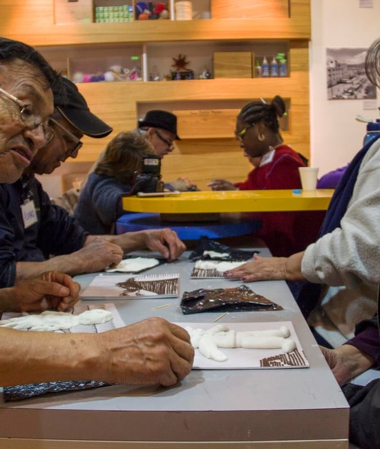 Elderly refugees enjoy a night at the museum