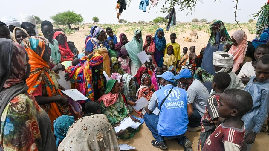 Sudanese refugees gather for a food distribution.