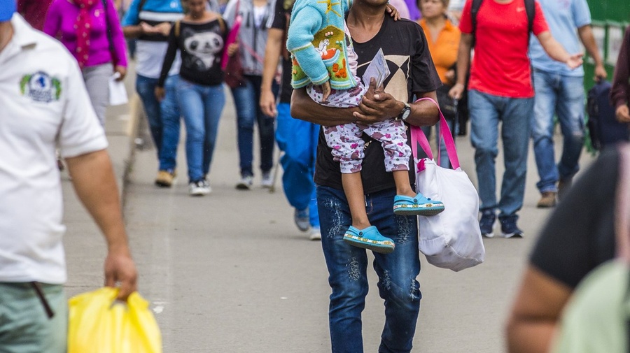 A man carrying his child