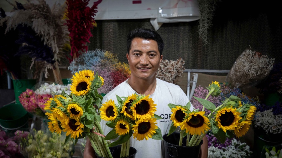 Iran. A young Afghan refugee working as a florist in Pakdasht.