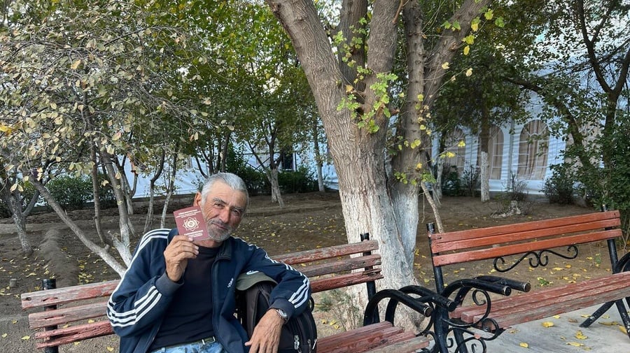 Turkmenistan. Former stateless person showing passport in Ashgabat.