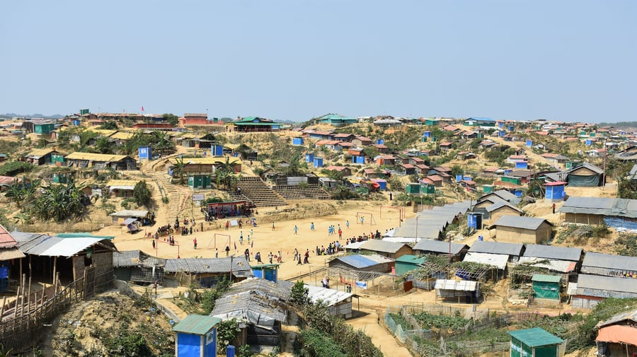 Rohingya refugees play football at a Cox's Bazar Refugee Camp