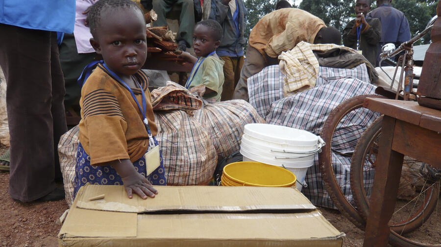 A baby, born a refugee in Tanzania, on her first morning in her homeland of Burundi after returning in a UNHCR-organized convoy.