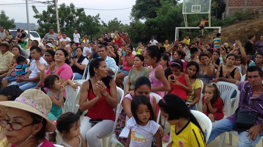 Residents of the informal Las Delicias neighbourhood of Cúcuta , Colombia attend a ceremony at which their settlement is incorporated into the city.