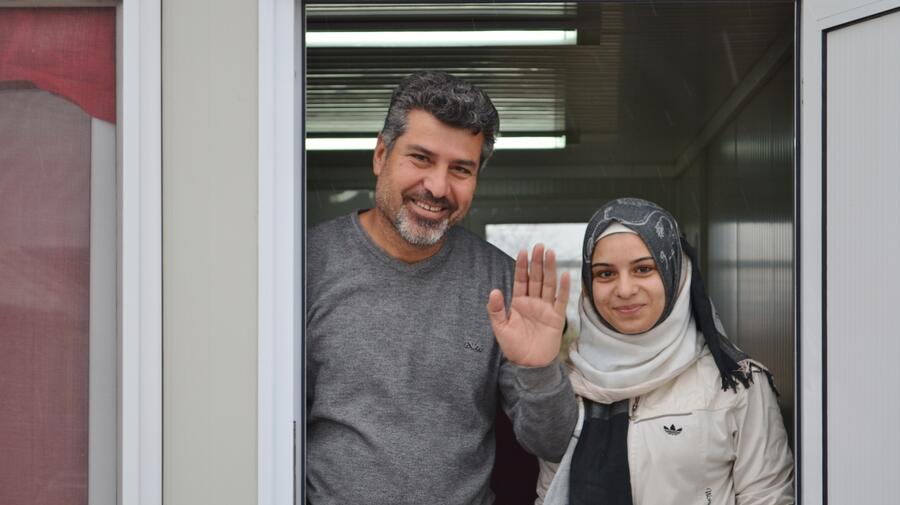 Former Yugoslav Republic of Macedonia. Syrian refugee Shergo and his daughter Avin with a rare smile on their faces