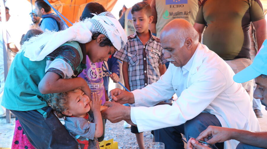 New arrivals are being vaccinated at Badoush mustering point in Iraq