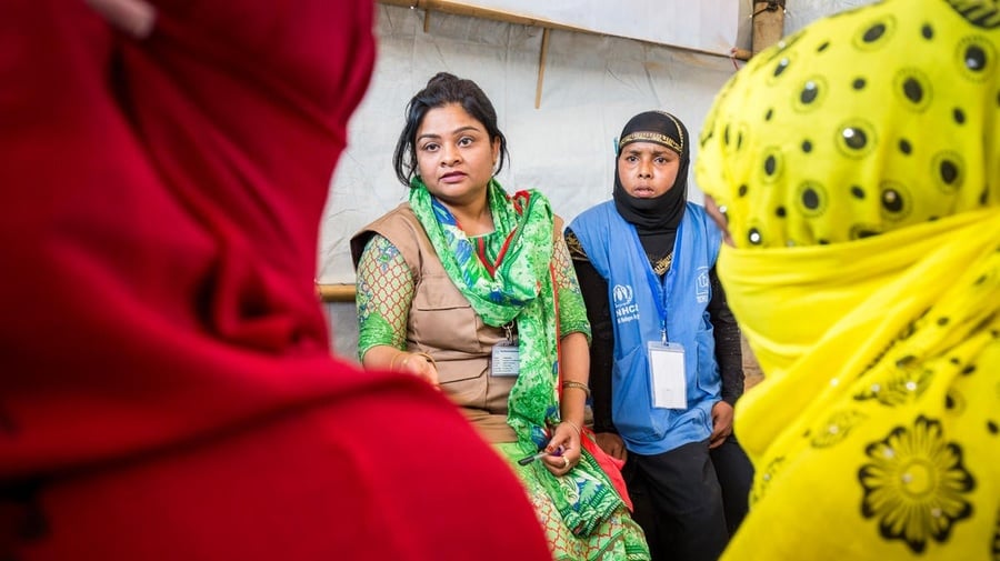 Bangladesh. Female head of households recieve assistance from Community Outreach Volunteers