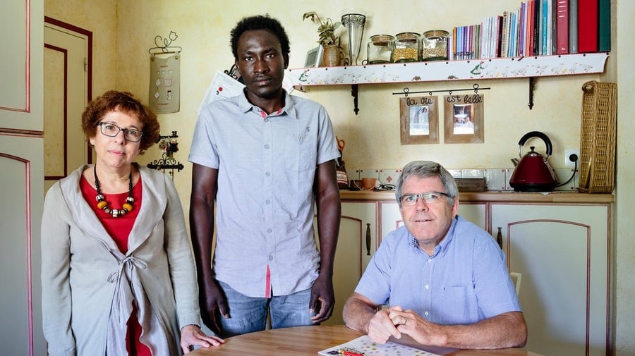 France. Annick and Hubert host Farah, a refugee from Sudan, in Rivière.  This portrait is part of the No Stranger Place series, which portrays locals and refugees living together