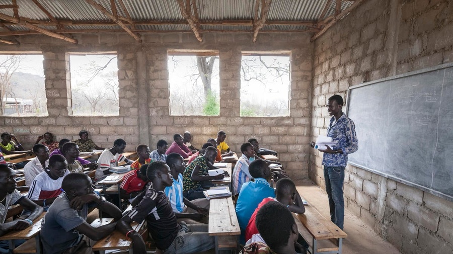 South Sudanese teacher Lim Bol teaches at a primary school in Kule refugee camp, Ethiopia, March 2016.