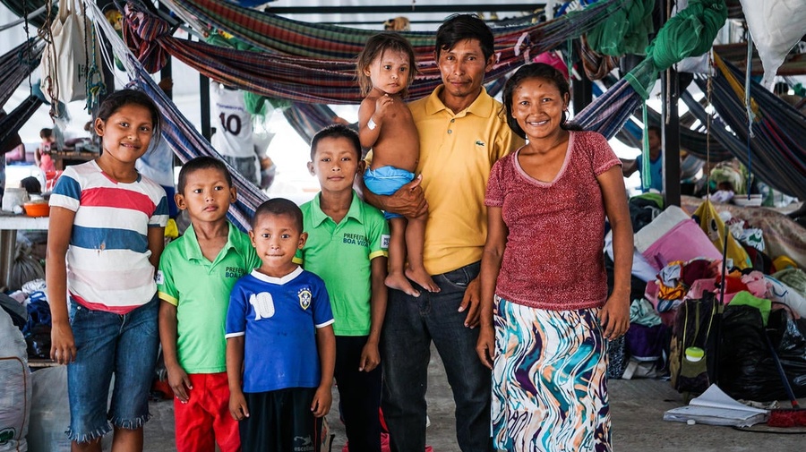 Euligio Baez, a Warao leader from Venezuela, poses with his family in Boa Vista, Brazil