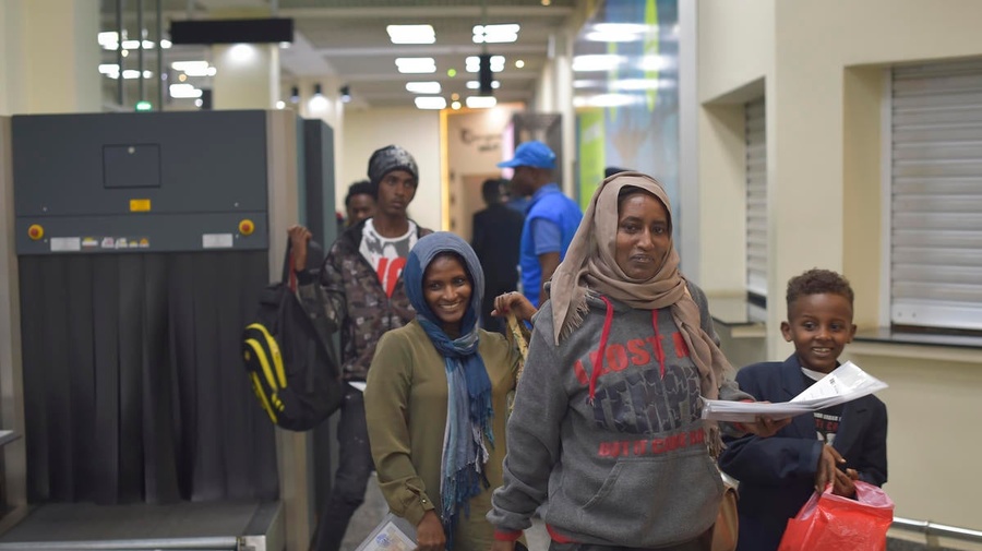 Refugees arrive in Kigalii, Rwanda after an evacuation flight form Libya