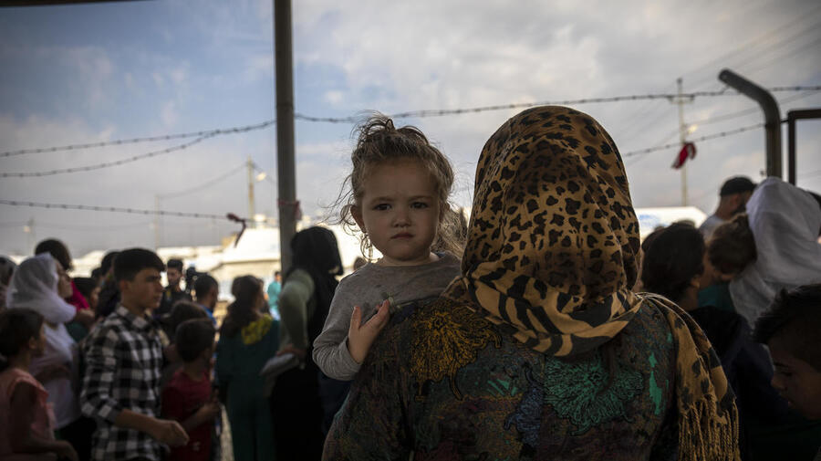 Iraq. Syrian refugees fleeing military campaign receive aid at UNHCR camp
