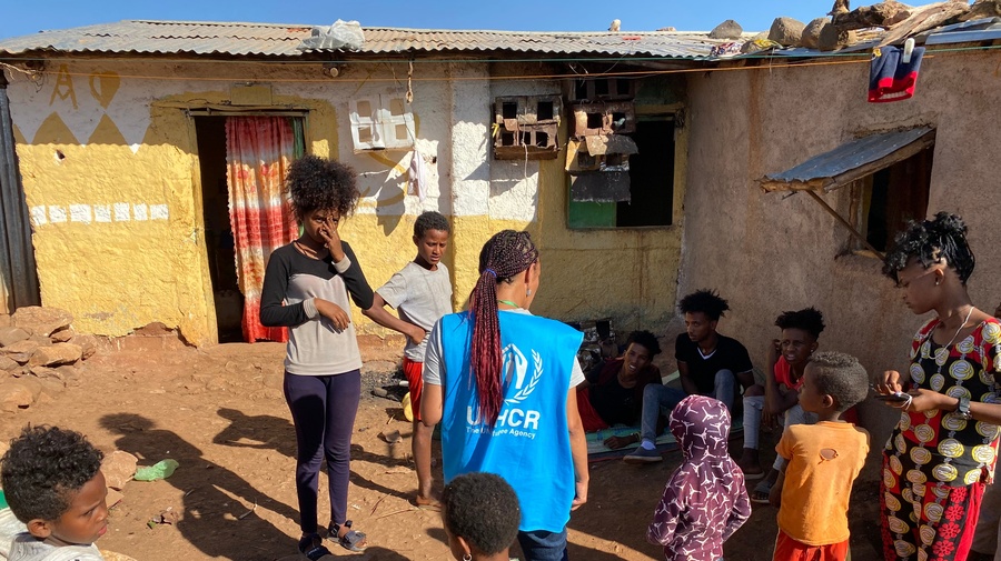 A UNHCR officer talks to refugees in Mai Aini refugee camp. The biggest concerns of the refugees are food, clean water, and the security situation in the camps. The refugees report almost nightly looting by armed gangs. 
