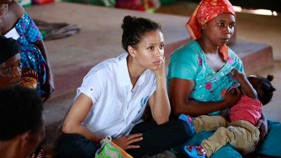 Uganda. UNHCR Supporter Gugu Mbatha-Raw at the Women's Centre in Nakivale Refugee Settlement, with Sifa Semeki, a refugee.