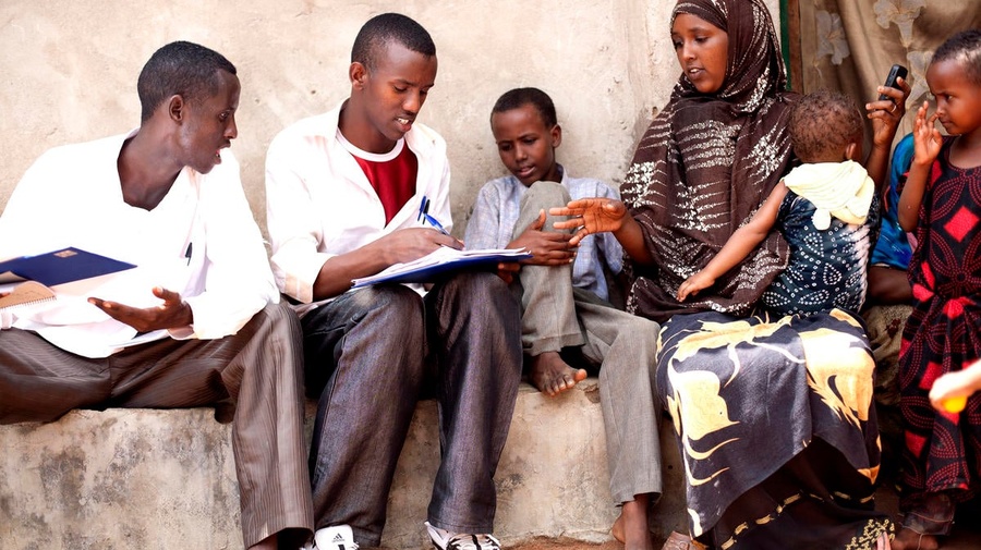 Kenya / Somali Refugees / Hagadera Dadaab Camp / School teachers on their break were recruited as data collectors for the nothing but nets mosquito net coverage surveys. Here the data collectors interview the head of household. / UNHCR / S. Hoibak / December 2010