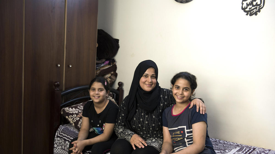 Jordan. Hanaa (27) and her daughters Joudy (12) and Lojain (10) at home